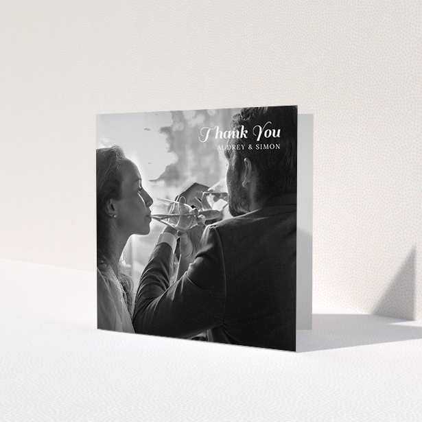 A wedding thank you card named 'Top-Right'. It is a square (148mm x 148mm) card in a square orientation. It is a photographic wedding thank you card with room for 1 photo. 'Top-Right' is available as a folded card, with mainly white colouring.