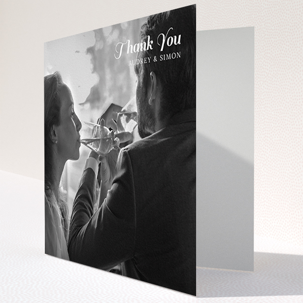 A wedding thank you card named "Top-Right". It is a square (148mm x 148mm) card in a square orientation. It is a photographic wedding thank you card with room for 1 photo. "Top-Right" is available as a folded card, with mainly white colouring.
