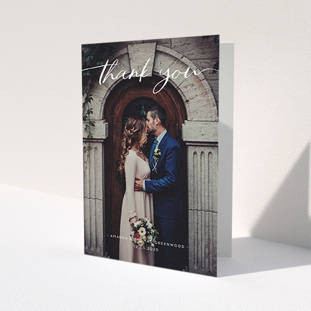 A wedding thank you card called 'Topped and Bottomed'. It is an A6 card in a portrait orientation. It is a photographic wedding thank you card with room for 1 photo. 'Topped and Bottomed' is available as a folded card, with mainly white colouring.
