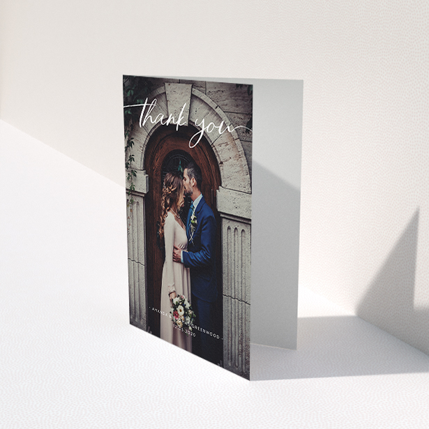 A wedding thank you card called "Topped and Bottomed". It is an A6 card in a portrait orientation. It is a photographic wedding thank you card with room for 1 photo. "Topped and Bottomed" is available as a folded card, with mainly white colouring.