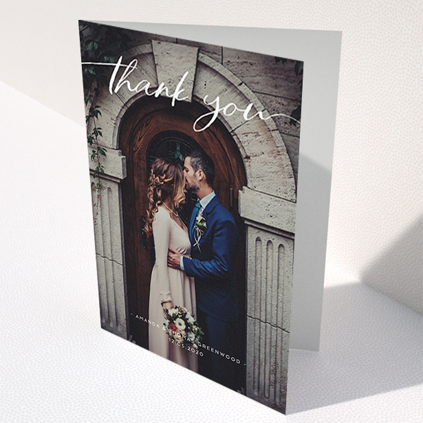 A wedding thank you card called "Topped and Bottomed". It is an A6 card in a portrait orientation. It is a photographic wedding thank you card with room for 1 photo. "Topped and Bottomed" is available as a folded card, with mainly white colouring.
