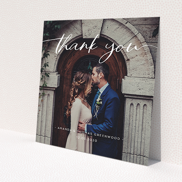 A wedding thank you card design called 'Topped and Bottomed'. It is a square (148mm x 148mm) card in a square orientation. It is a photographic wedding thank you card with room for 1 photo. 'Topped and Bottomed' is available as a flat card, with mainly white colouring.