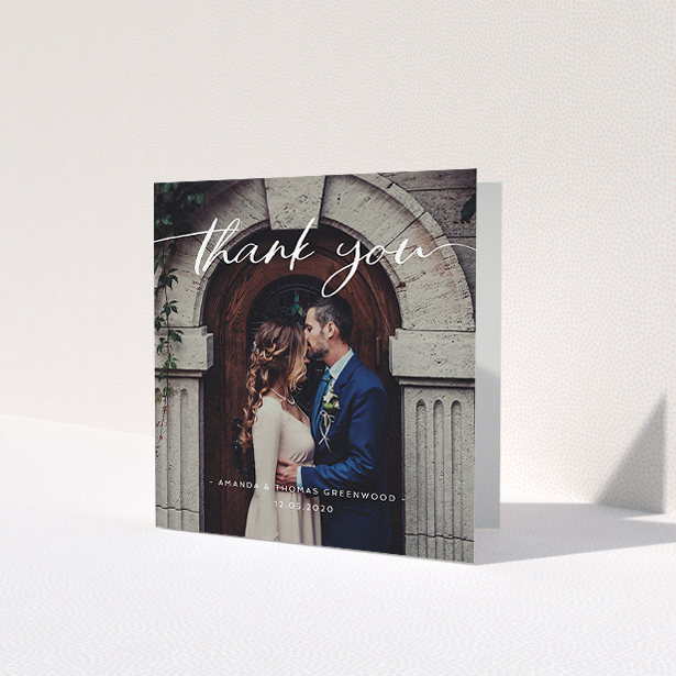 A wedding thank you card named 'Topped and Bottomed'. It is a square (148mm x 148mm) card in a square orientation. It is a photographic wedding thank you card with room for 1 photo. 'Topped and Bottomed' is available as a folded card, with mainly white colouring.
