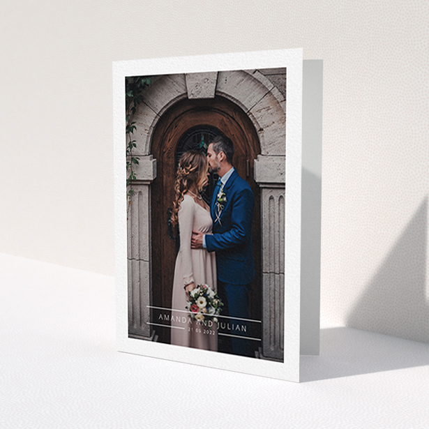 A wedding thank you card design titled 'Tramlines'. It is an A6 card in a portrait orientation. It is a photographic wedding thank you card with room for 1 photo. 'Tramlines' is available as a folded card, with mainly white colouring.