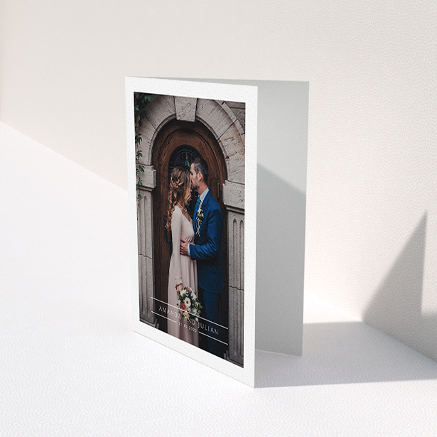 A wedding thank you card design titled "Tramlines". It is an A6 card in a portrait orientation. It is a photographic wedding thank you card with room for 1 photo. "Tramlines" is available as a folded card, with mainly white colouring.