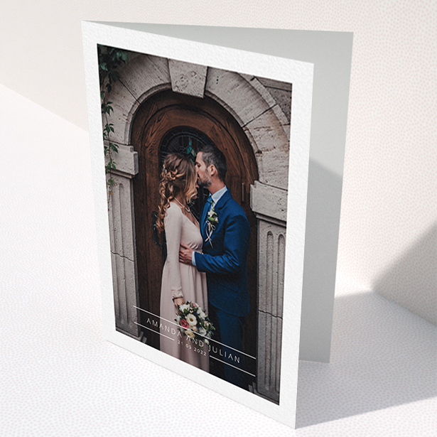 A wedding thank you card design titled "Tramlines". It is an A6 card in a portrait orientation. It is a photographic wedding thank you card with room for 1 photo. "Tramlines" is available as a folded card, with mainly white colouring.