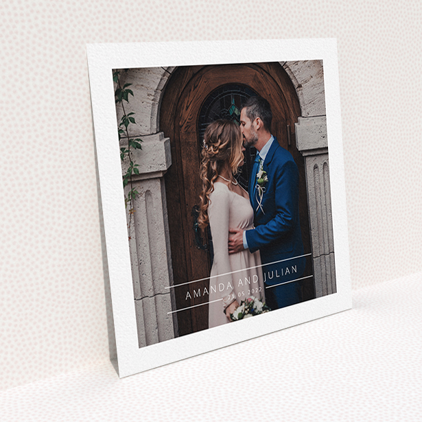 A wedding thank you card design titled "Tramlines". It is a square (148mm x 148mm) card in a square orientation. It is a photographic wedding thank you card with room for 1 photo. "Tramlines" is available as a flat card, with mainly white colouring.