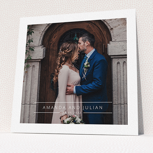 A wedding thank you card design titled "Tramlines". It is a square (148mm x 148mm) card in a square orientation. It is a photographic wedding thank you card with room for 1 photo. "Tramlines" is available as a flat card, with mainly white colouring.