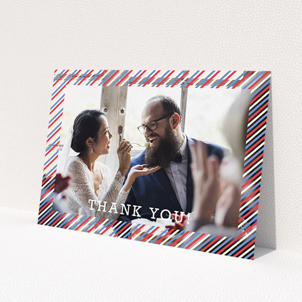 A wedding thank you card design called 'Tricolour Photo Frame'. It is an A5 card in a landscape orientation. It is a photographic wedding thank you card with room for 1 photo. 'Tricolour Photo Frame' is available as a flat card, with mainly white colouring.