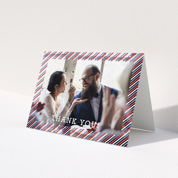 A wedding thank you card named 'Tricolour Photo Frame'. It is an A5 card in a landscape orientation. It is a photographic wedding thank you card with room for 1 photo. 'Tricolour Photo Frame' is available as a folded card, with mainly white colouring.