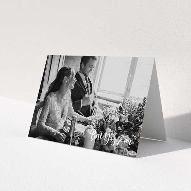 A wedding thank you card named 'Truly It Was'. It is an A6 card in a landscape orientation. It is a photographic wedding thank you card with room for 1 photo. 'Truly It Was' is available as a folded card, with mainly white colouring.