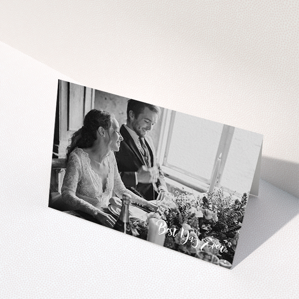 A wedding thank you card named "Truly It Was". It is an A6 card in a landscape orientation. It is a photographic wedding thank you card with room for 1 photo. "Truly It Was" is available as a folded card, with mainly white colouring.