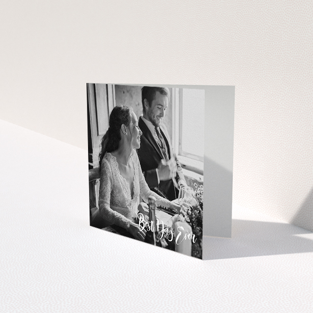 A wedding thank you card named "Truly It Was". It is a square (148mm x 148mm) card in a square orientation. It is a photographic wedding thank you card with room for 1 photo. "Truly It Was" is available as a folded card, with mainly white colouring.
