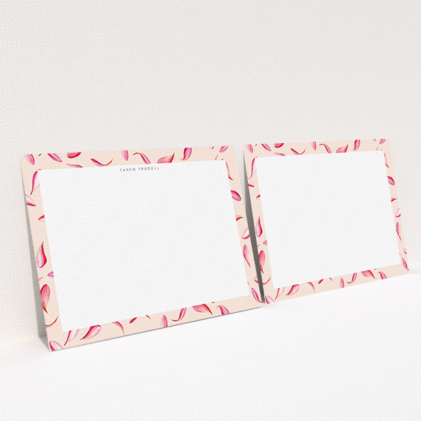 A womens correspondence card design titled "Petal confetti". It is an A6 card in a landscape orientation. "Petal confetti" is available as a flat card, with tones of pink, red and white.