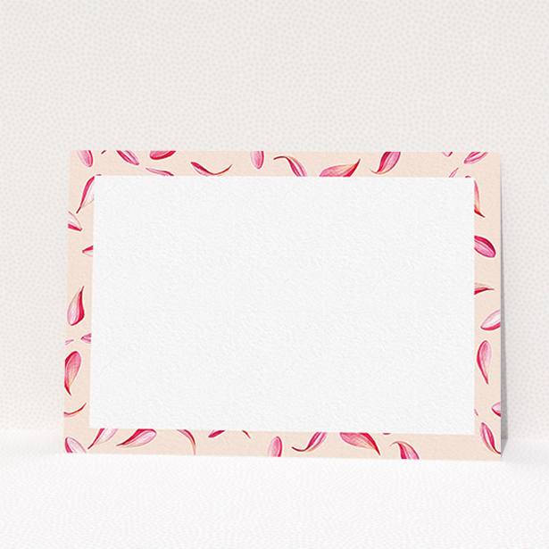 A womens correspondence card design titled "Petal confetti". It is an A6 card in a landscape orientation. "Petal confetti" is available as a flat card, with tones of pink, red and white.