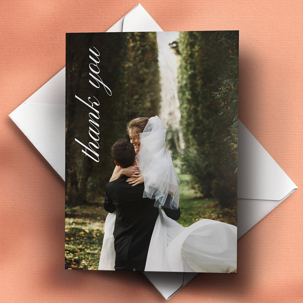 A white, a5 portrait photo wedding thank you card with a classic style.