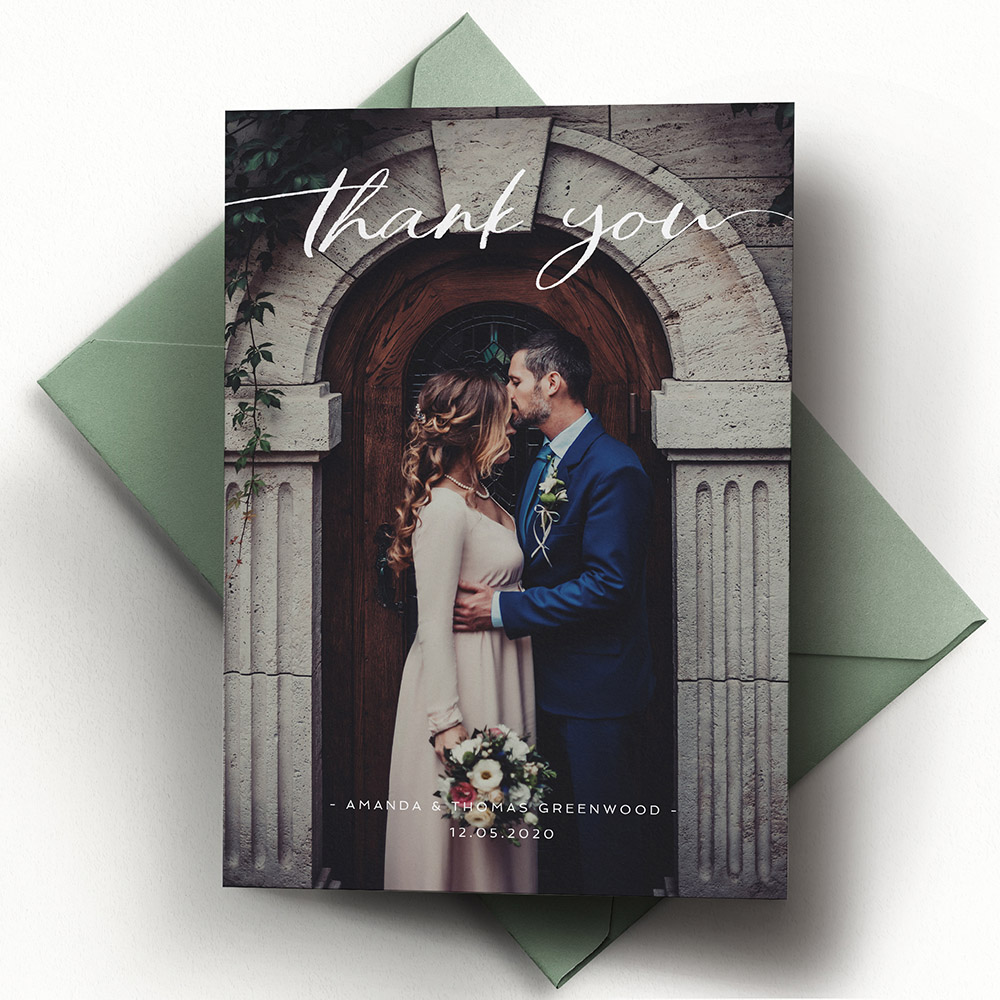 A white, a5 portrait wedding thank you card with photos with a classic style.