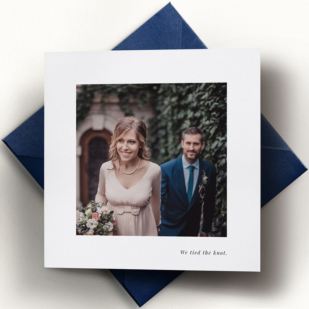 A white, square traditional wedding thank you card with an elegant style.