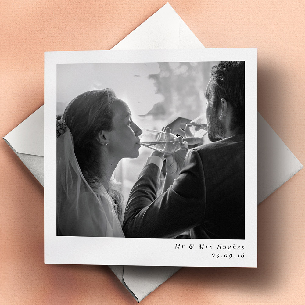 A white, square traditional wedding thank you card with an unique style.