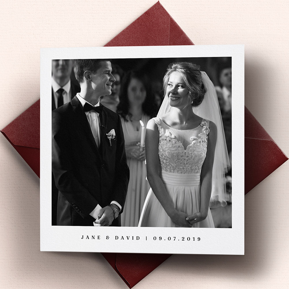 A white, square premium wedding thank you card with a vintage style.