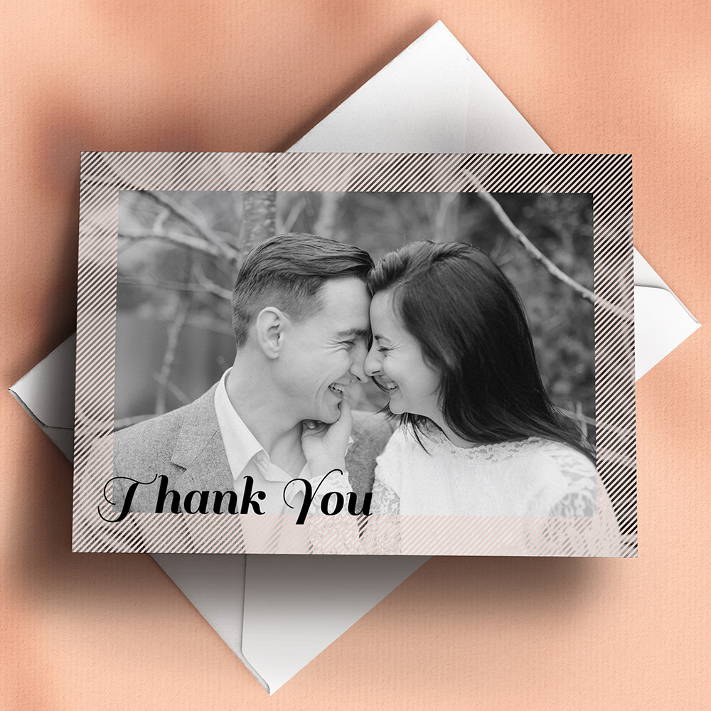 A light pink, a6 landscape wedding thank you card with photos with a modern style.