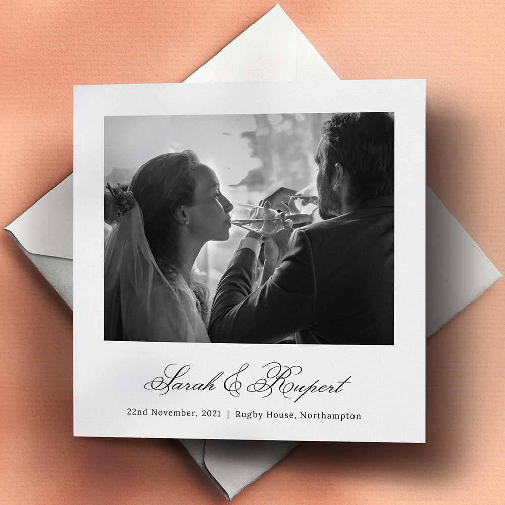 A white, square premium wedding thank you card with a traditional style.