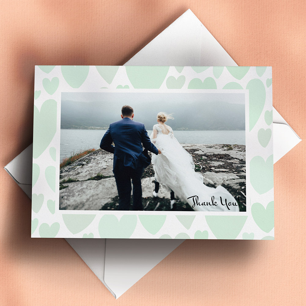 A green and white, a6 landscape photo wedding thank you card with an unique style.