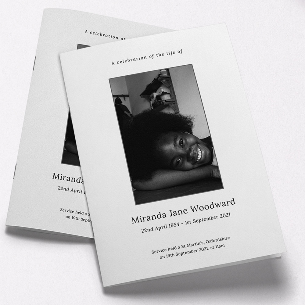 A white and black, a5 portrait multipage funeral programme with an elegant style.