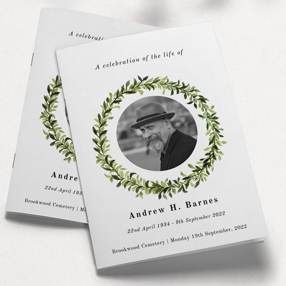 A white and green, a5 portrait stapled funeral order of service with a floral style.