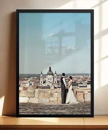 Framed photo of a wedding couple overlooking a cityscape