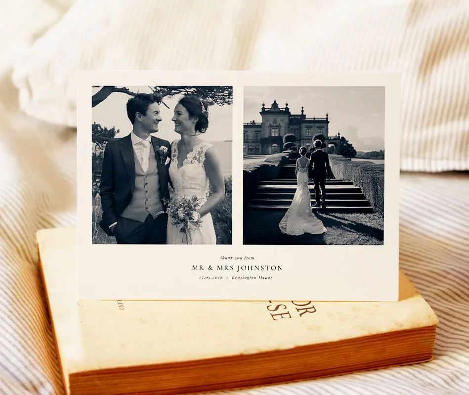 Black and white wedding thank you card featuring a couple's photos