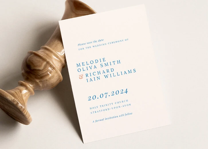 Refined save the date card with blue typography and minimalistic design elements