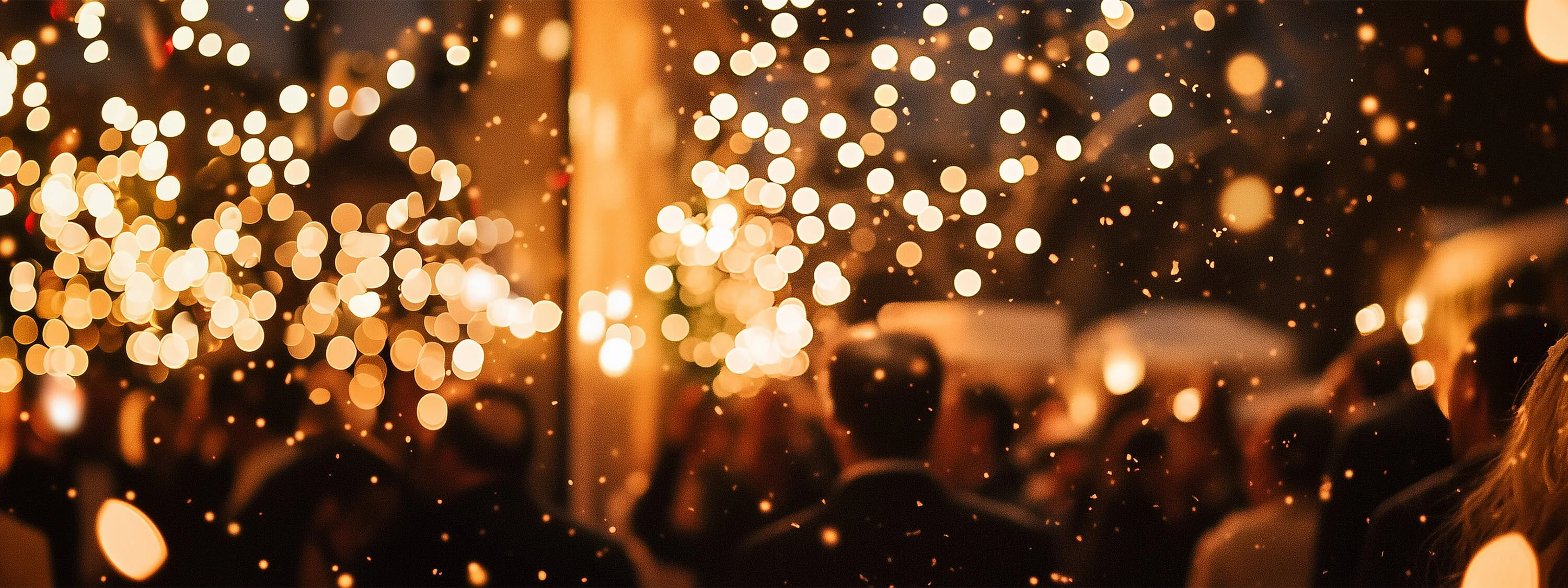 Festive banner featuring golden bokeh lights and a warm holiday atmosphere, evoking the seasonal charm of Christmas and New Year celebrations.