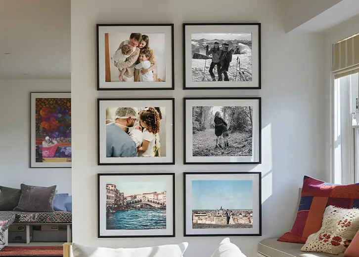 Wall-mounted collection of framed custom photo prints