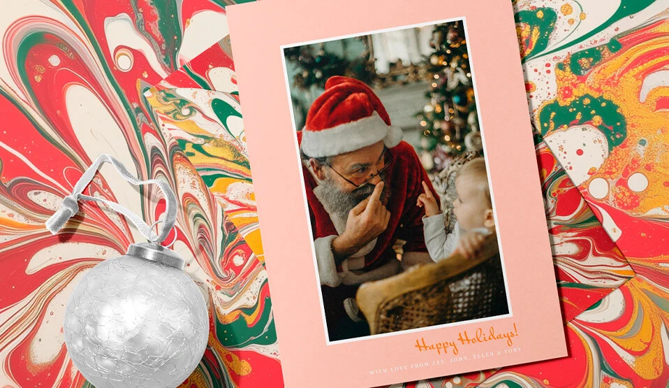 Heartwarming Christmas Card design featuring Santa Claus sharing a playful moment with a child during the holidays