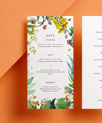 Wedding menu card with a vibrant floral border and elegant typography