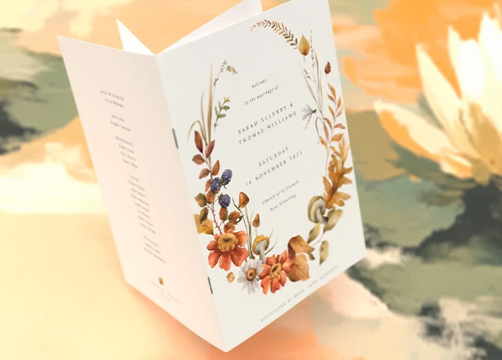 Wedding order of service card featuring a floral wreath design