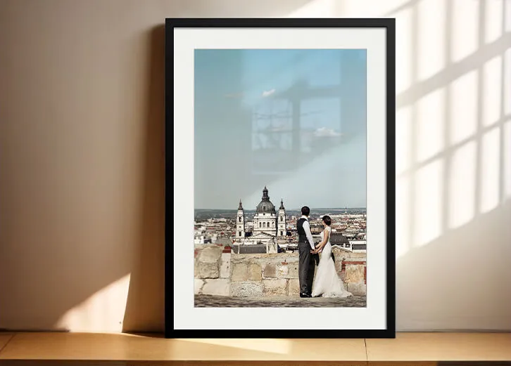 Elegant framed wedding photo overlooking a historic cityscape, perfect for gifts or decor