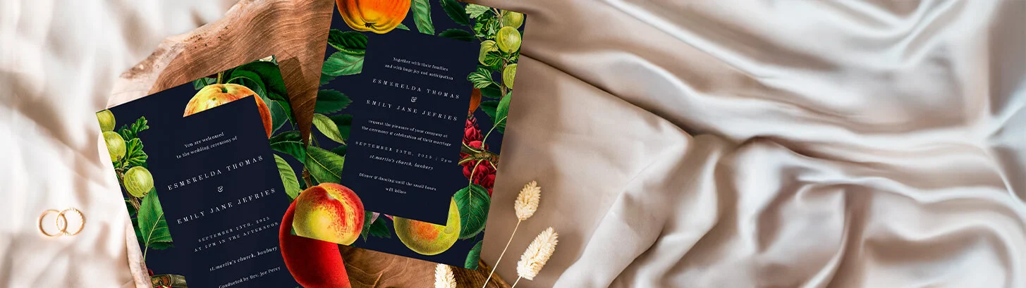 Wedding invitation suite with a vibrant fruit theme and dark backdrop