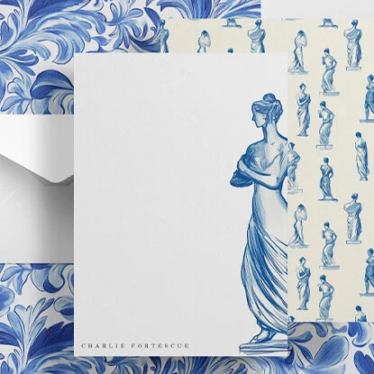 Elegant writing paper featuring a blue Greek statue illustration