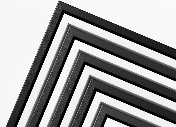 Elegant black and white frames arranged in a geometric pattern, showcasing modern design