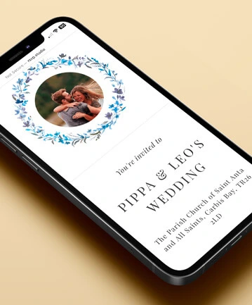 Digital wedding invitation displayed on a smartphone with a circular floral design