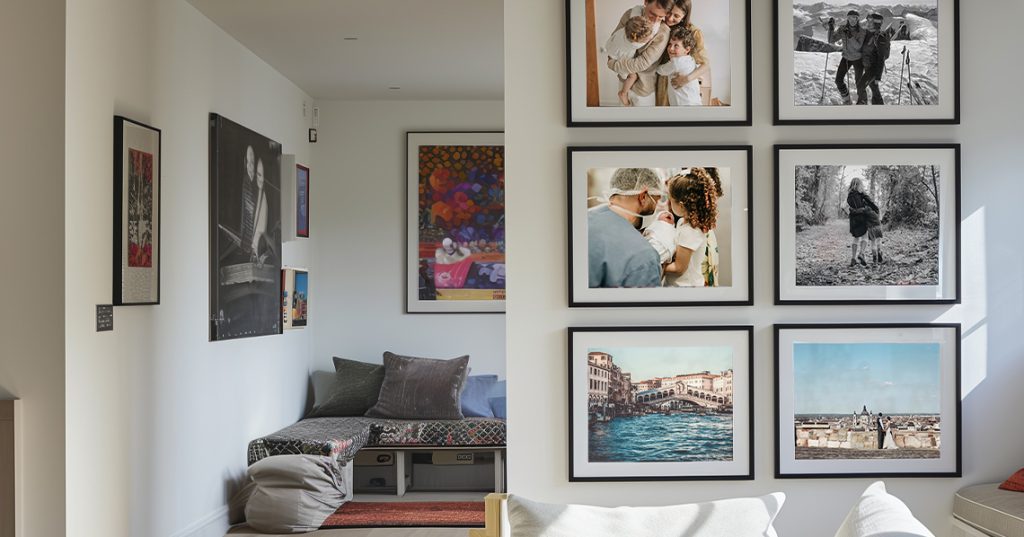 A lifestyle shot of printed framed photos on wall