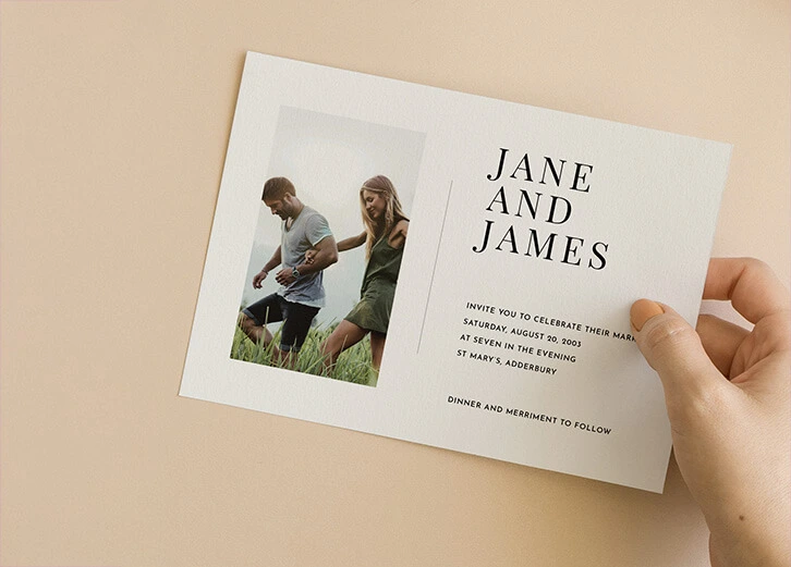 Save-the-date card with an outdoor couple's photo, rustic setting, and elegant typography