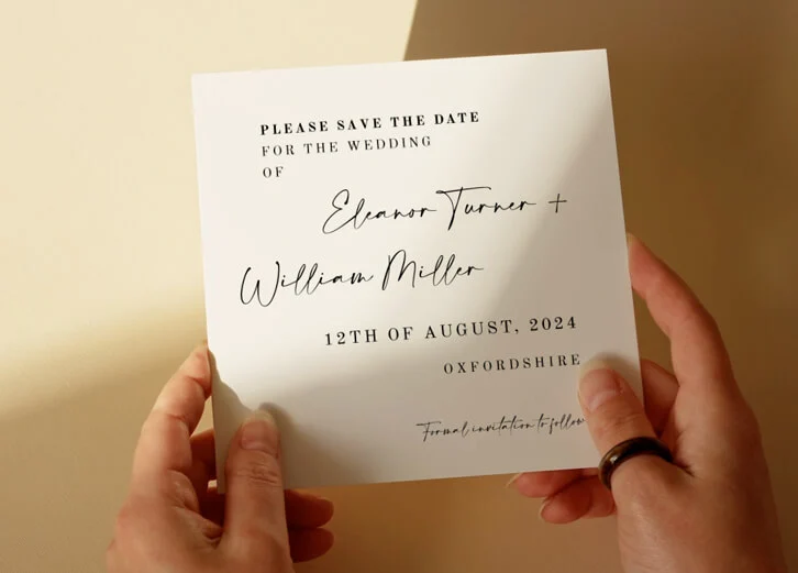 Minimalist save the date card with handwritten script and clean layout