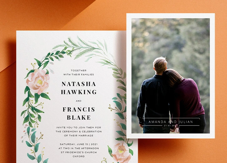 Wedding invitation featuring a romantic floral wreath design and a couple's intimate photo