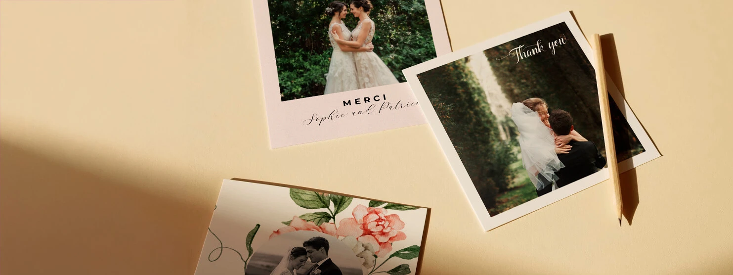 Personalised wedding thank you cards featuring couple's photos and floral designs