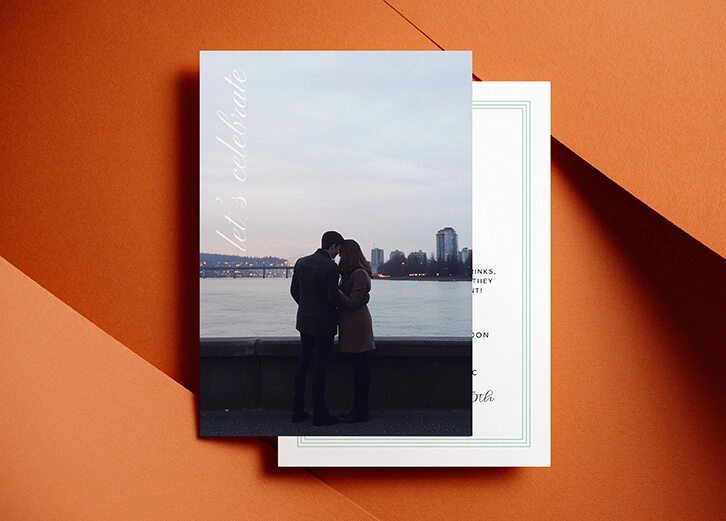 Modern photo-style engagement party invitation featuring a couple by the waterfront