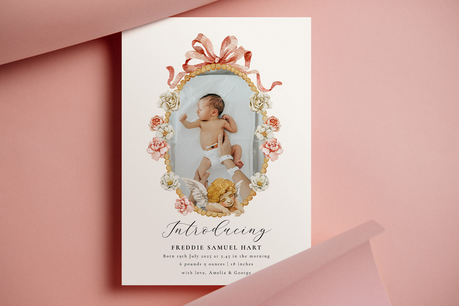 Birth announcement card with floral and ribbon border, featuring a newborn baby and elegant script on a white background.