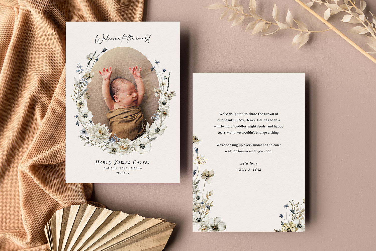 Birth announcement card featuring a newborn baby wrapped in a blanket, surrounded by delicate floral illustrations and
